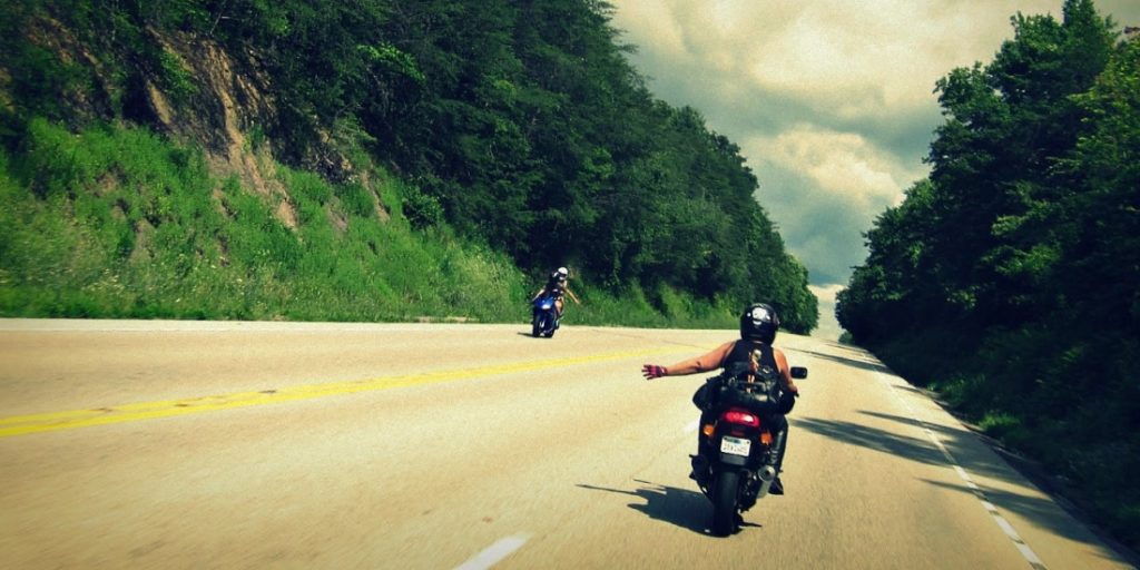bikers waving on road
