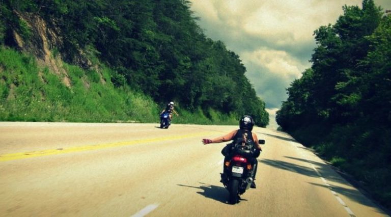 bikers waving on road
