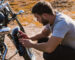 Biker taking a picture of the breakdown of his motorcycle