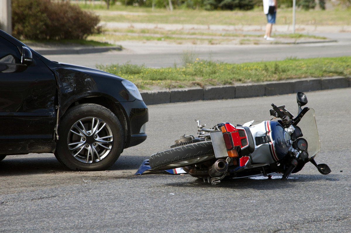 crash car and moto bike on road