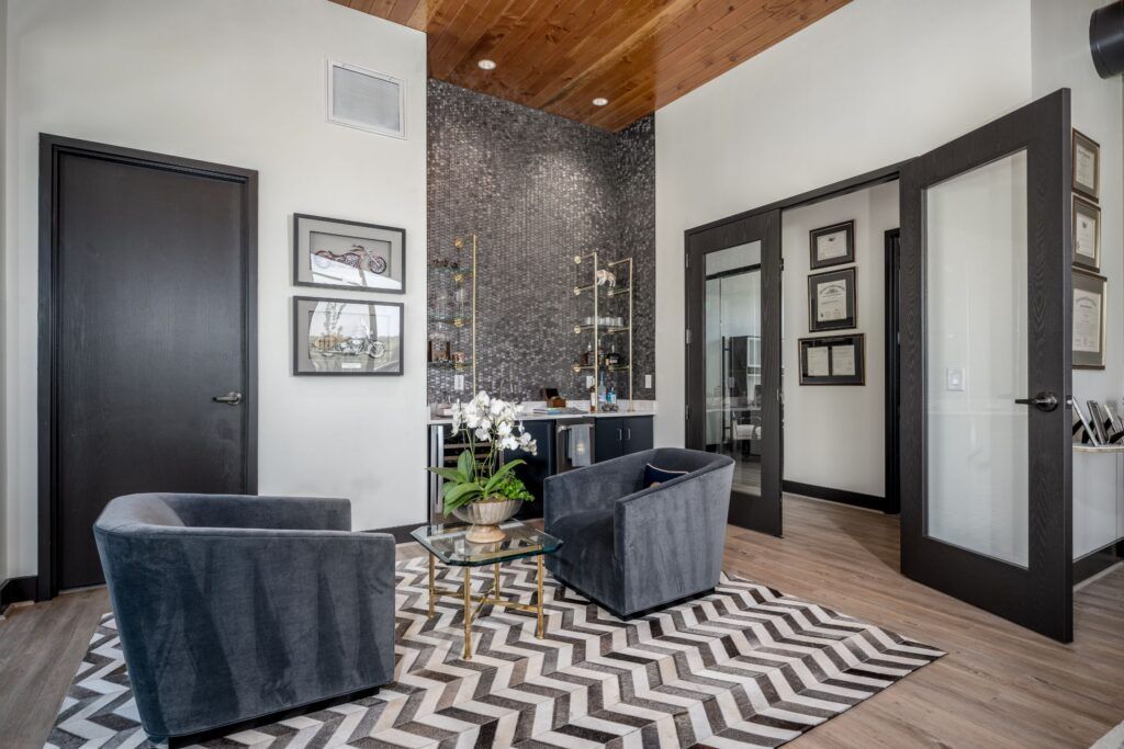 Karney Clayton law office reception area with modern furnishings and dark framed doors